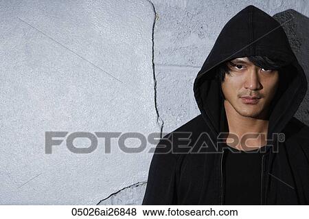 head shot of young man in hooded sweatshirt View Large Photo Image Stock Photo - head shot of young man in hooded sweatshirt. Fotosearch