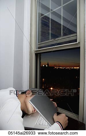 man asleep in laptop at night View Large Photo Image Stock Image - man asleep in laptop at night. Fotosearch