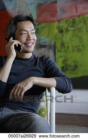 man talking on phone and smiling View Large Photo Image Stock Photo - man talking on phone and smiling. Fotosearch