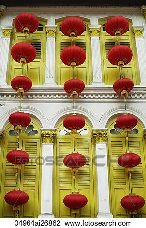 red lanterns tied together in front of yellow wooden shutters of old building View Large Photo Image Stock Image - red lanterns tied together in front of yellow wooden shutters of old building. Fotosearch