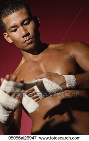 shirtless man wrapping his fist View Large Photo Image Stock Photo - shirtless man wrapping his fist. Fotosearch