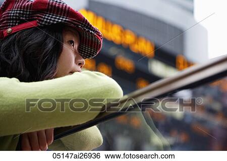 woman wearing hat looking over railing View Large Photo Image Stock Photograph - woman wearing hat looking over railing. Fotosearch