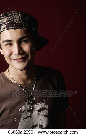 young man in hat smiling at camera View Large Photo Image Stock Photo - young man in hat smiling at camera. Fotosearch