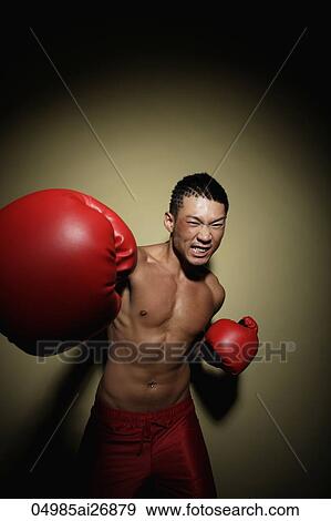 young man punching to camera with red gloves View Large Photo Image Stock Photo - young man punching to camera with red gloves. Fotosearch