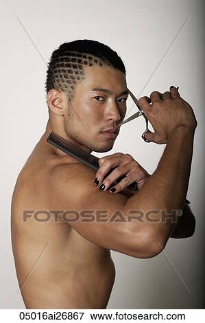 young man with no shirt holding scissors and comb View Large Photo Image Stock Photo - young man with no shirt holding scissors and comb. Fotosearch