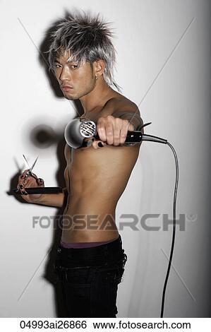 young man with silver hair holding silver hair dryer and scissors View Large Photo Image Stock Photograph - young man with silver hair holding silver hair dryer and scissors. Fotosearch