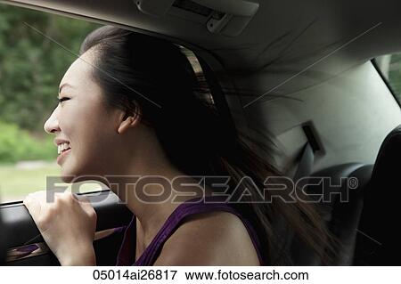 young woman leaning head out of the window smiling View Large Photo Image Stock Photo - young woman leaning head out of the window smiling. Fotosearch