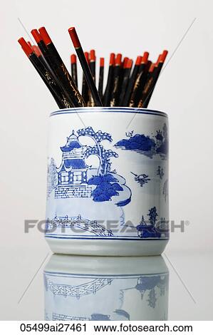 Stock Image - A bunch of chopsticks in a Chinese vase. Fotosearch