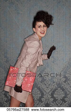 Asian woman holding present and laughing View Large Photo Image Stock Photo - Asian woman holding present and laughing. Fotosearch