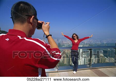 China, Hong Kong, Couple taking photos at Victoria Peak View Large Photo Image Stock Image - China, Hong Kong, Couple taking photos at Victoria Peak. Fotosearch