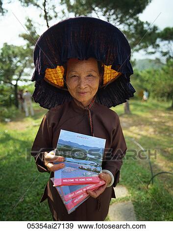 China, Hong Kong, New Territories, Hakka Woman at the Kam Tin Walled Village View Large Photo Image Stock Photo - China, Hong Kong, New Territories, Hakka Woman at the Kam Tin Walled Village. Fotosearch