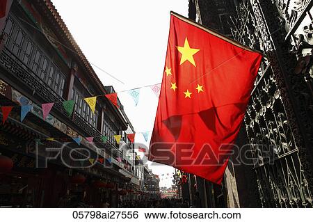Stock Photograph - Chinese flag hanging from window. Fotosearch
