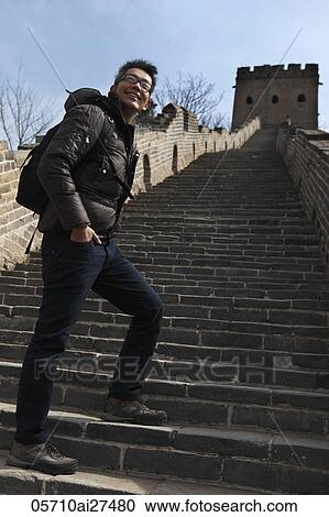 Chinese man walking up stairs on The Great Wall of China View Large Photo Image Stock Image - Chinese man walking up stairs on The Great Wall of China. Fotosearch