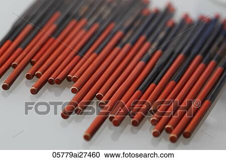 Stock Image - chopsticks lined up in a row. Fotosearch