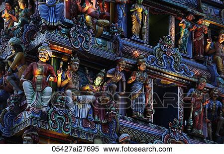 Stock Photography - Close up of carvings on Hindu temple at night. Fotosearch