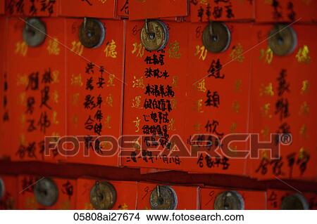 Different fortunes written on red paper at a Buddhist Temple View Large Photo Image Picture - Different fortunes written on red paper at a Buddhist Temple. Fotosearch