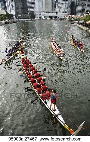 Dragon boats floating down Boat Quay, Singapore View Large Photo Image Stock Photo - Dragon boats floating down Boat Quay, Singapore. Fotosearch