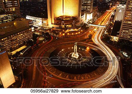 Evening view of Hotel Indonesia roundabout, Welcome Monument along Jalan Thamrin, Jakarta View Large Photo Image Stock Photo - Evening view of Hotel Indonesia roundabout, Welcome Monument along Jalan Thamrin, Jakarta. Fotosearch