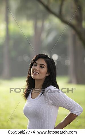 Half shot of Indian woman smiling outdoors View Large Photo Image Picture - Half shot of Indian woman smiling outdoors. Fotosearch