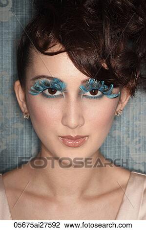 Head shot of Asian woman with false blue feather eye lashes View Large Photo Image Stock Image - Head shot of Asian woman with false blue feather eye lashes. Fotosearch