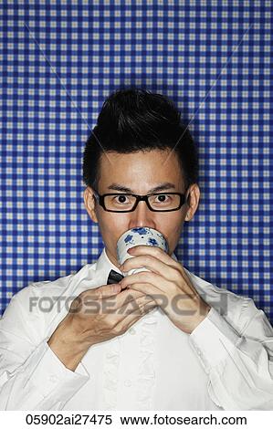 Head shot of Chinese man wearing glasses and drinking tea View Large Photo Image Stock Photography - Head shot of Chinese man wearing glasses and drinking tea. Fotosearch