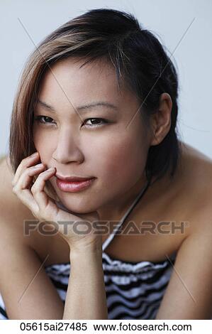 Head shot of Chinese woman with hand on chin View Large Photo Image Stock Photography - Head shot of Chinese woman with hand on chin. Fotosearch