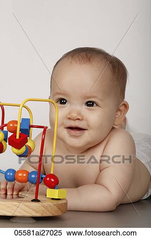 head shot of mixed race baby smiling with toy View Large Photo Image Stock Photography - head shot of mixed race baby smiling with toy. Fotosearch