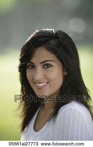 Head shot of young Indian woman smiling View Large Photo Image Stock Image - Head shot of young Indian woman smiling. Fotosearch