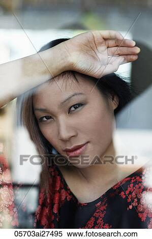 Head shot of young woman looking out window View Large Photo Image Stock Photography - Head shot of young woman looking out window. Fotosearch