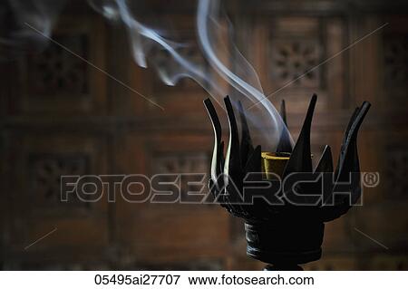 Incense burning in lotus incense burner View Large Photo Image Stock Photo - Incense burning in lotus incense burner. Fotosearch
