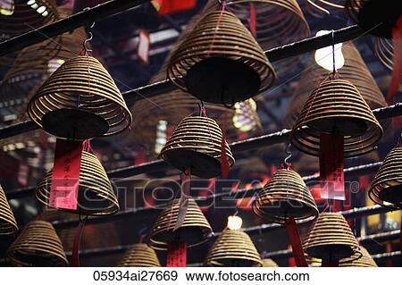 Incense coils hanging from ceiling. Man Mo Temple, Hong Kong View Large Photo Image Stock Photo - Incense coils hanging from ceiling. Man Mo Temple, Hong Kong. Fotosearch