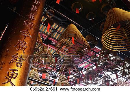 Stock Image - Incense in Man Mo temple. Fotosearch