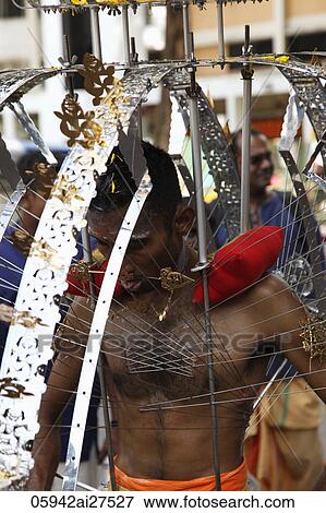 Indian man during Thaipusam festival, Singapore View Large Photo Image Stock Photo - Indian man during Thaipusam festival, Singapore. Fotosearch