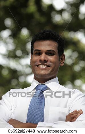 Indian man looking at camera and smiling View Large Photo Image Stock Photo - Indian man looking at camera and smiling. Fotosearch