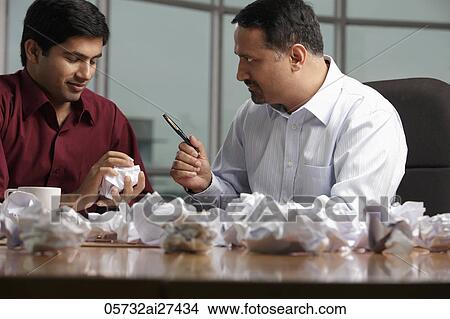 Picture - Indian men discussing ideas. Fotosearch