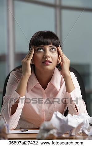 Indian woman holding her head and looking up. View Large Photo Image Stock Image - Indian woman holding her head and looking up.. Fotosearch