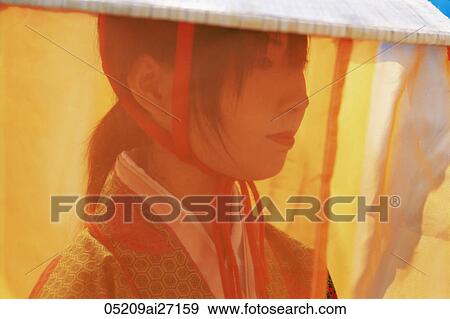 Stock Photo - Japan, Tokyo, Portrait of Girl Dressed in Traditional Costume at Jidai Matsuri Festival held Annually in November at Sensoji Temple Asakusa. Fotosearch