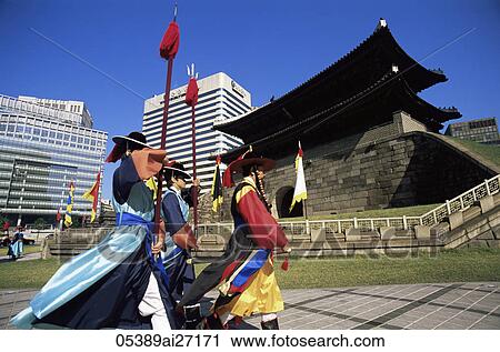 Stock Image - Korea, Seoul, Sungnyemun, South Gate, Traditional Guarding Ceremony in Front of Sungnyemun Gate. Fotosearch