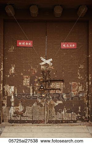 Stock Photo - Locked door with Chinese signs. Fotosearch