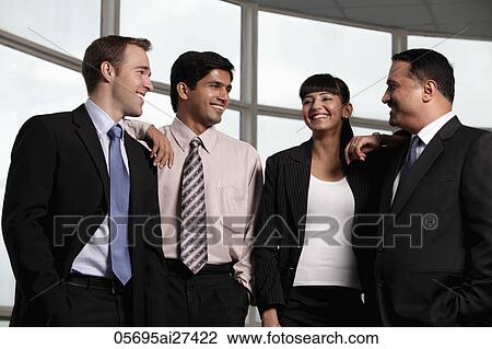 Mixed raced group smiling at each other View Large Photo Image Stock Image - Mixed raced group smiling at each other. Fotosearch