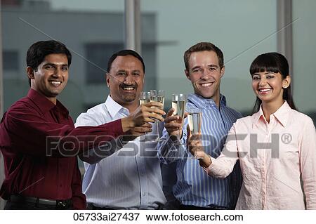 Stock Photo - mixed raced group toasting each other. Fotosearch