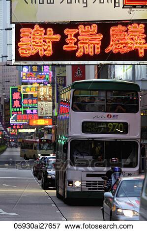 Stock Photo - Neon signs at night with traffic. Hong Kong, China. Fotosearch