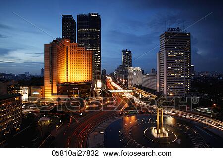 Night view of Hotel Indonesia roundabout, Welcome Monument and buildings along Jalan Thamrin, Jakarta View Large Photo Image Stock Image - Night view of Hotel Indonesia roundabout, Welcome Monument and buildings along Jalan Thamrin, Jakarta. Fotosearch