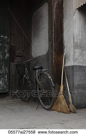 Old bicycle and broom in doorway. Beijing, China View Large Photo Image Stock Photo - Old bicycle and broom in doorway. Beijing, China. Fotosearch