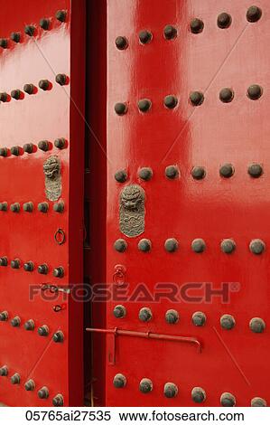 Stock Photography - Red doors with Lion heads. Fotosearch