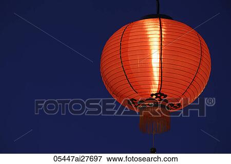 Stock Photo - Red lantern glowing at night. Fotosearch