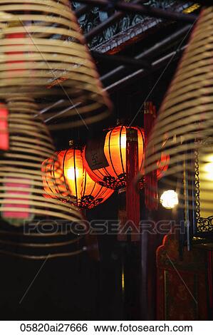 Red lanterns with incense coils in foreground View Large Photo Image Stock Photograph - Red lanterns with incense coils in foreground. Fotosearch