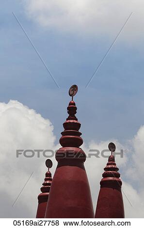 Red turrets of Hindu temple with "OM" in Sanskrit on top. View Large Photo Image Stock Photo - Red turrets of Hindu temple with "OM" in Sanskrit on top.. Fotosearch