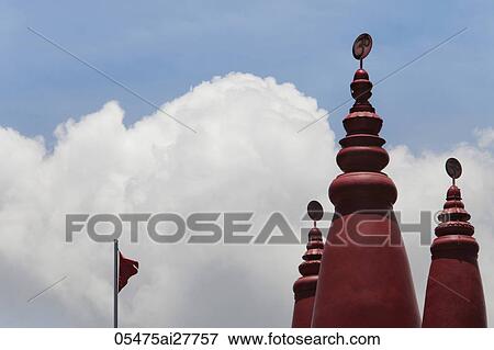 Red turrets of Hindu Temple with "OM" in Sanskrit on top View Large Photo Image Stock Photo - Red turrets of Hindu Temple with "OM" in Sanskrit on top. Fotosearch