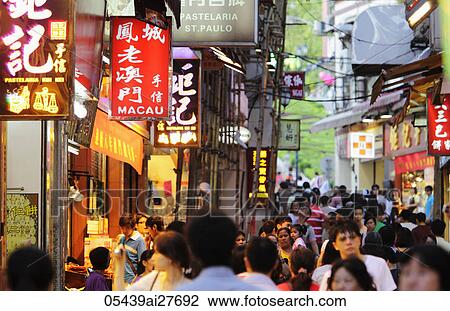 Street signs with busy crowd underneath View Large Photo Image Stock Image - Street signs with busy crowd underneath. Fotosearch